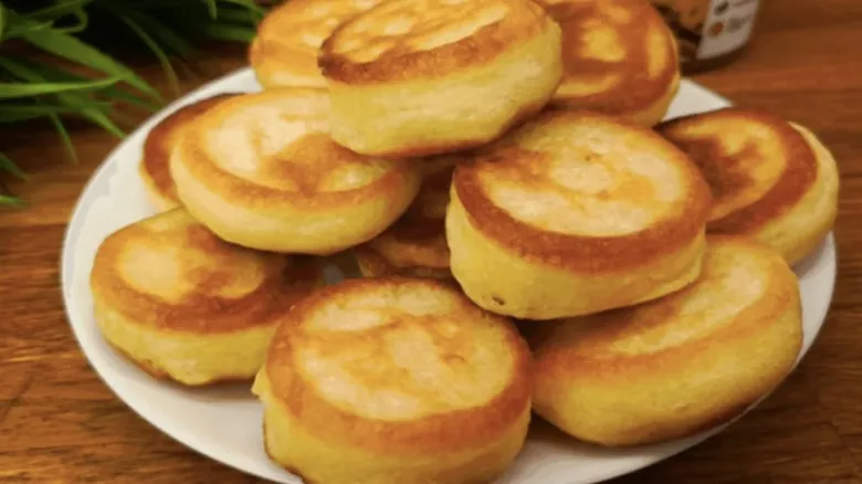 Golden pancakes on plate